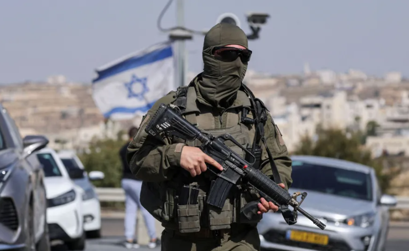 A member of the Israeli forces is seen in Hebron in the occupied West Bank following Friday’s shooting [Ammar Awad/Reuters]